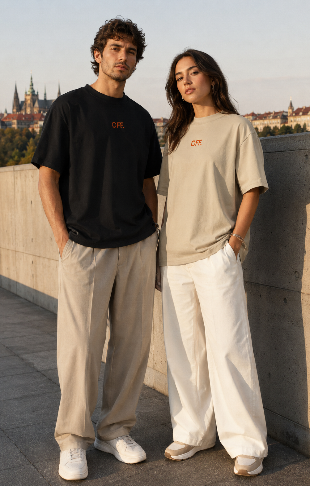 Young couple wearing black and stone oversized organic cotton T-shirts with OFF embroidery.