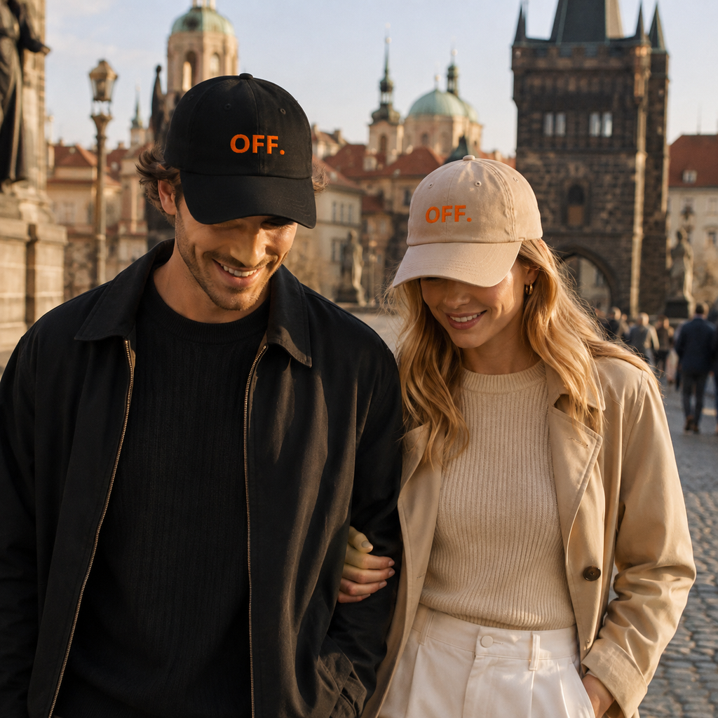 Young couple wearing black and stone OFF embroidered caps while walking in Prague.
