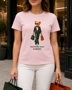 Close-up of the teddy bear print on a pink Shopping Is My Cardio T-shirt