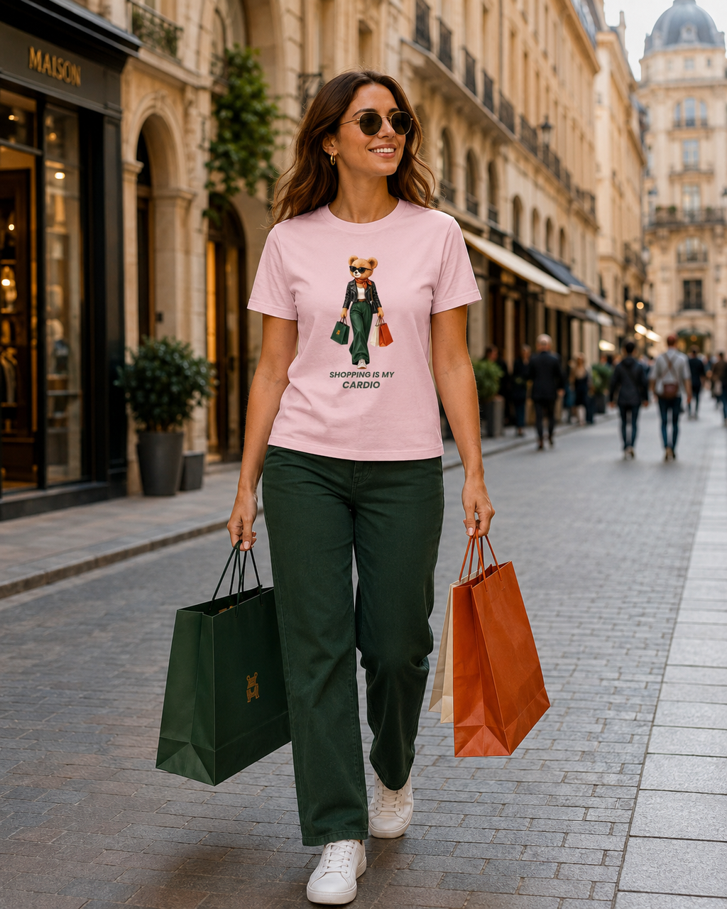 Woman wearing a pink Shopping Is My Cardio T-shirt while shopping in the city