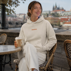 Woman wearing a cream organic cotton WEEKEND embroidered hoodie